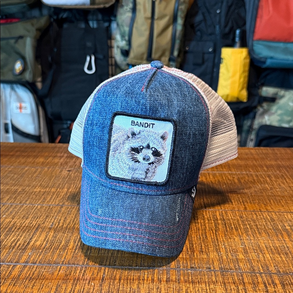 Goorin Brothers Animal Farm Blue and White Trucker Hat with Raccoon Patch